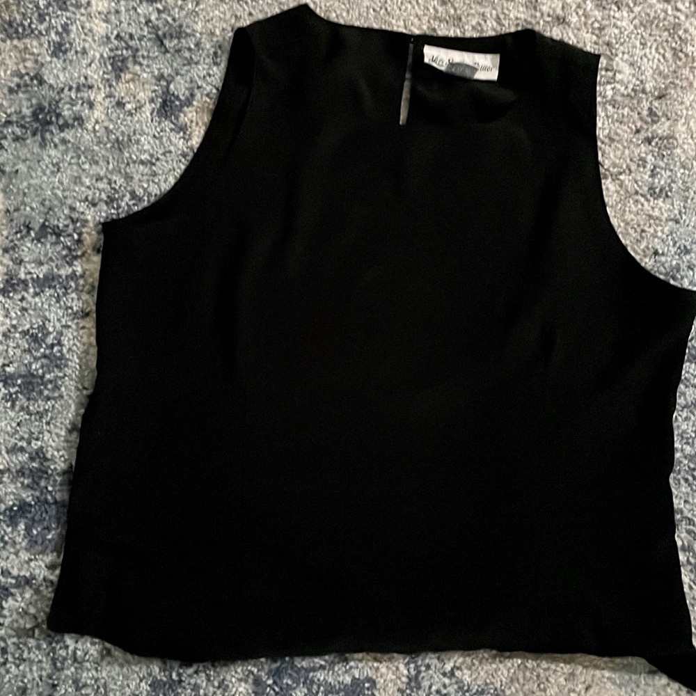 Sleeveless top. Perfect under jacket.